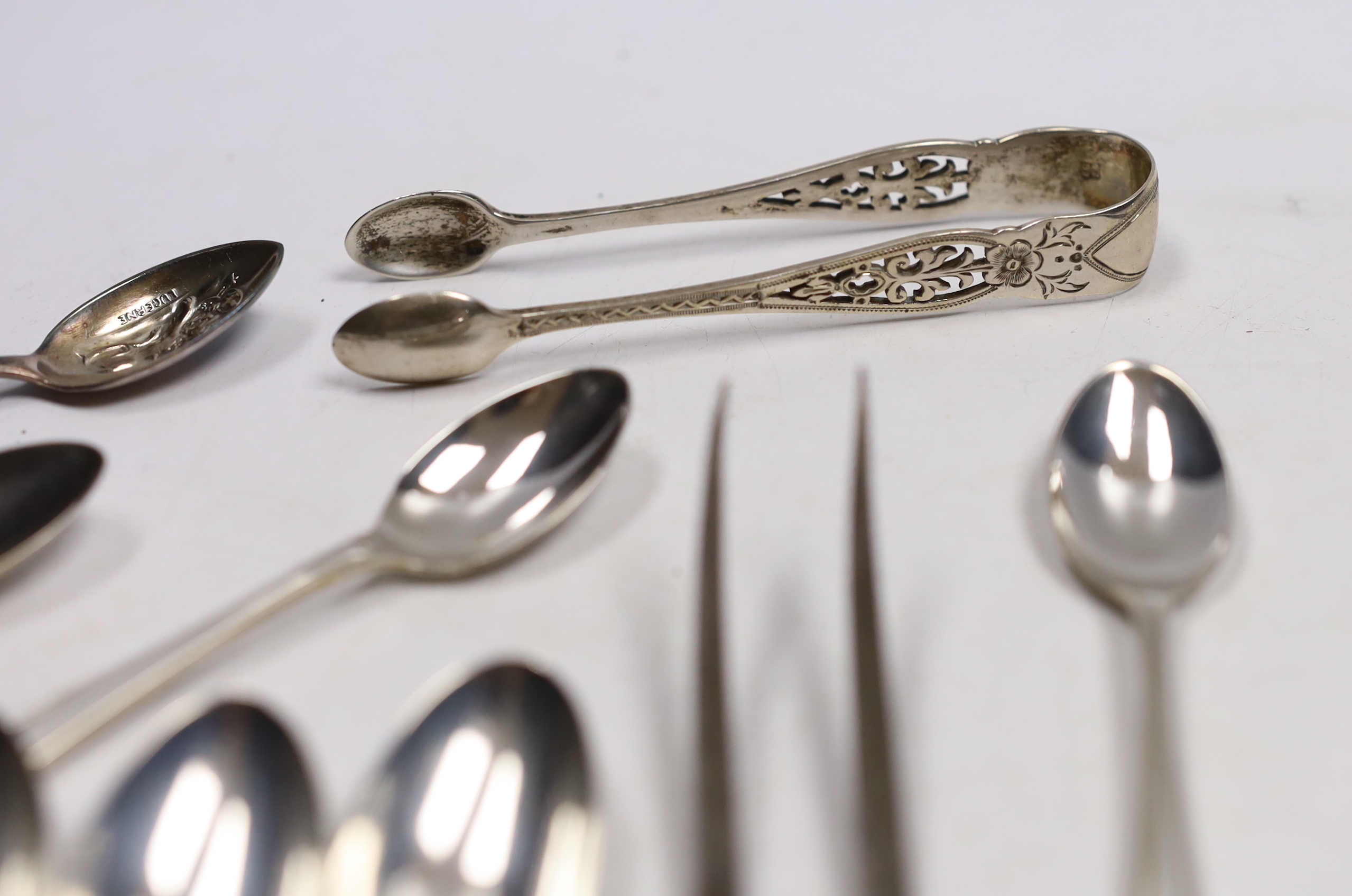 A set of twelve George V silver coffee spoons, with pierced handles, Josiah Williams & Co, London, 1912, 11.5cm, seven other silver spoons, a plated spoon and a three piece stag horn handled carving set.